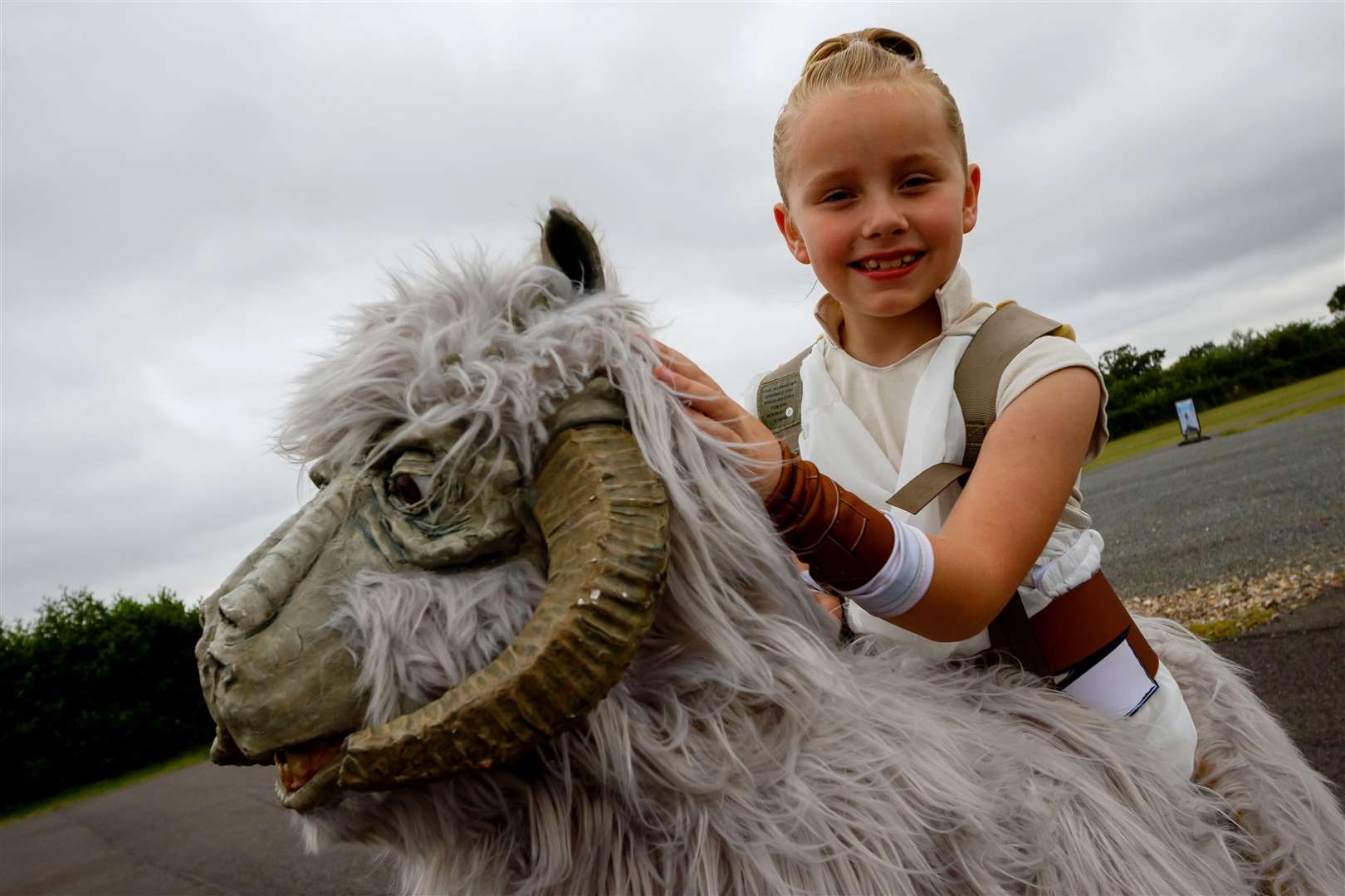 Lily Beeney with her Tauntaun. Pictures: Mark Bullimore .