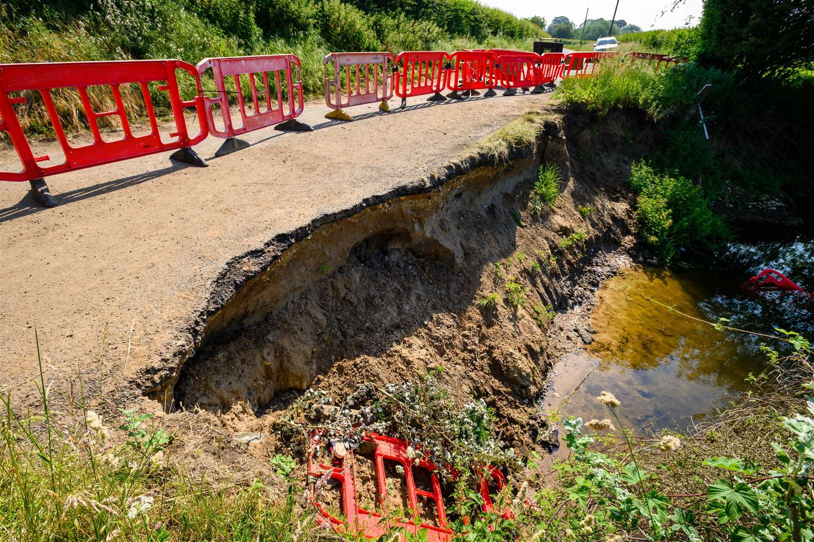 Low Road has been closed since Christmas after the ground supporting the road was swept away due to rain swelling the river levels during the winter. Picture: Mark Bullimore Photography.