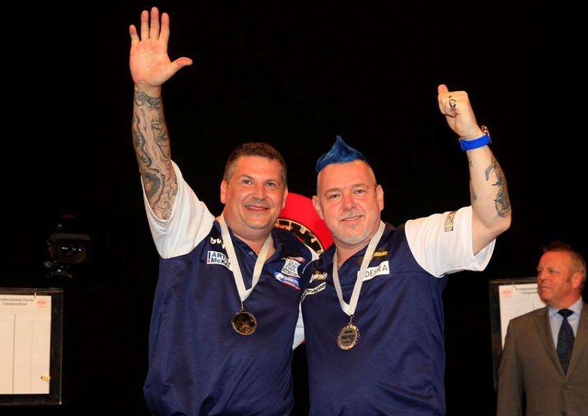 GREAT SCOTS: Gary Anderson and Mendham's Peter Wright with their runners-up medals from last weekend's World Cup of Darts in Germany