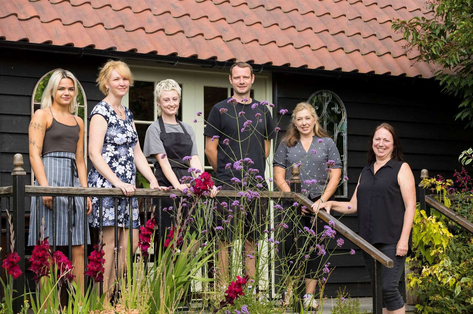 Jan Wise (left) with her Walnut Tree team outside her village shop next to the award-winning pub. Picture: Keith Mindham