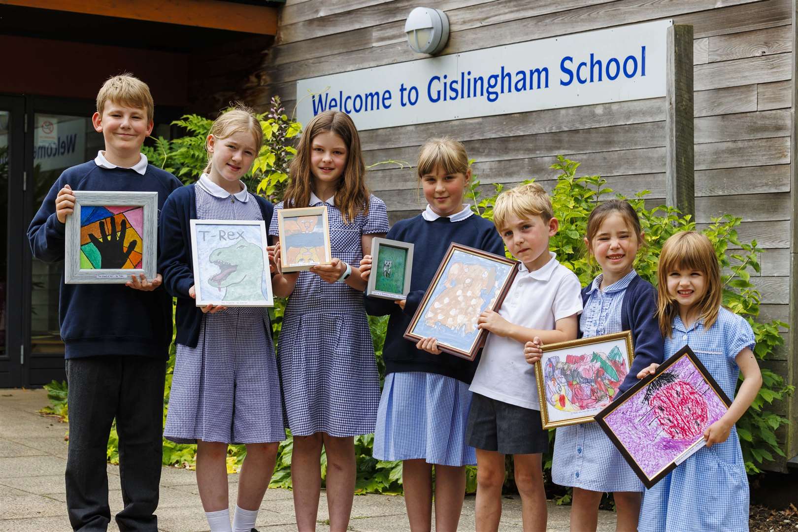 Pupils Toby, Vianne, Amelia, Harriet, Arthur, Macy and Rosalyn with their artworks. Picture: Mark Bullimore Photography 2022.