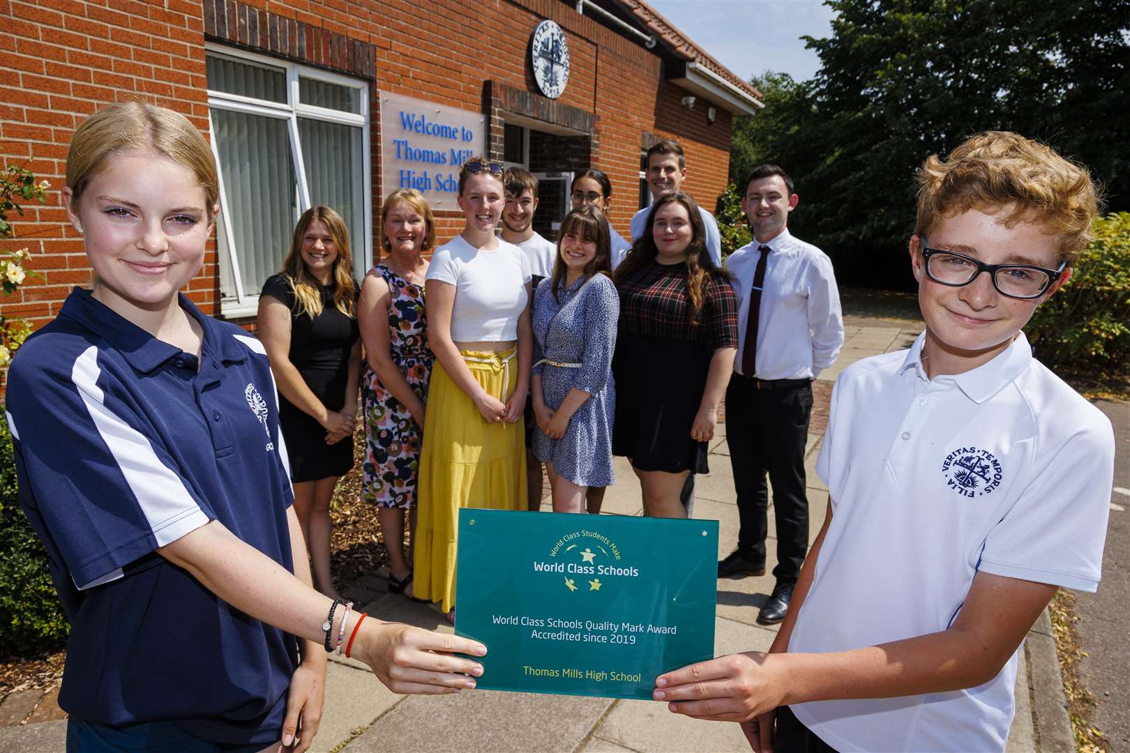Thomas Mills pupils Charlotte Gray and James Ambrose holding the school's world class honour. Picture: Mark Bullimore Photography 2022.
