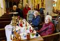 Villagers cast admiring glances at beautiful nativity scene