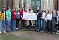 Diss six formers hand over charity cheque for £3,500