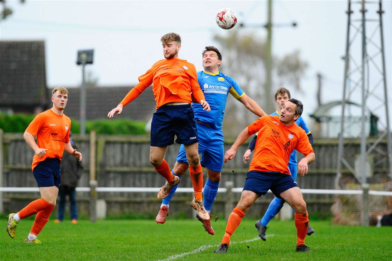 Harry Creamer and March's Danny Emmington battle for a header. Picture: Mark Bullimore Photography.