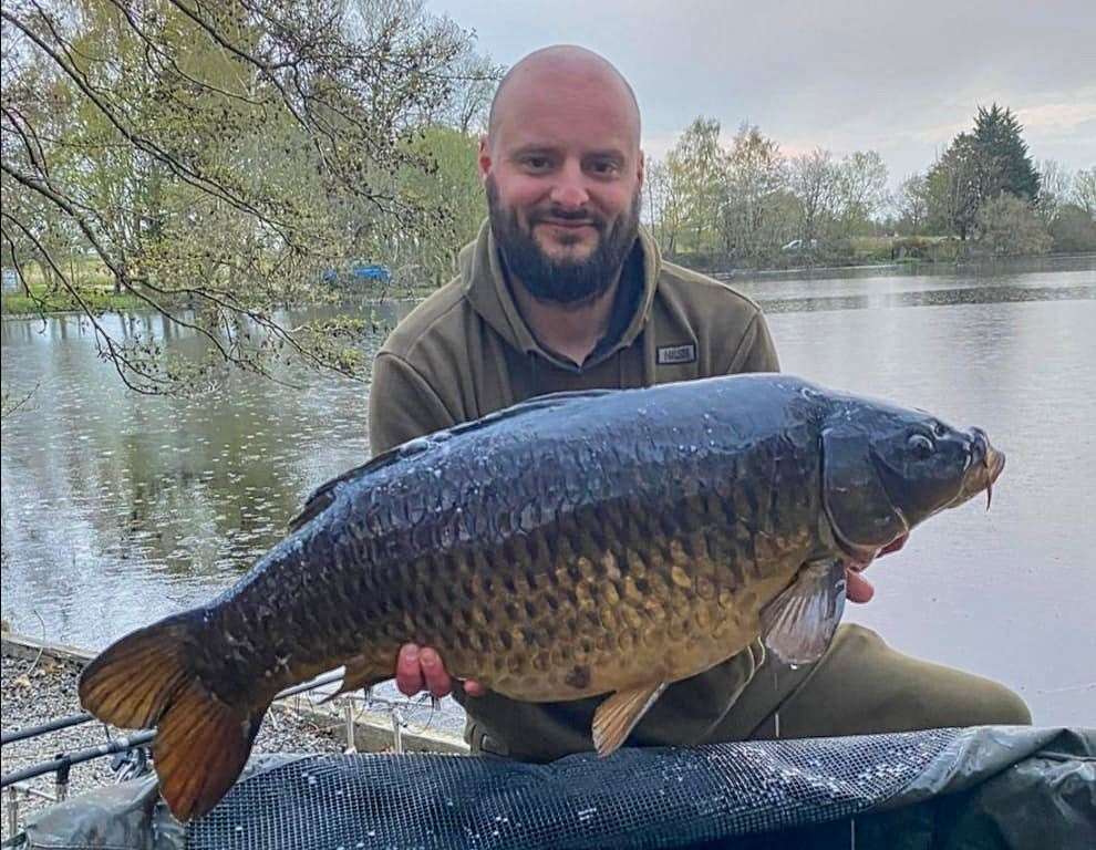 Lee Buckenham with his 30lb carp from Swangey Lakes. Picture: Simon Jones