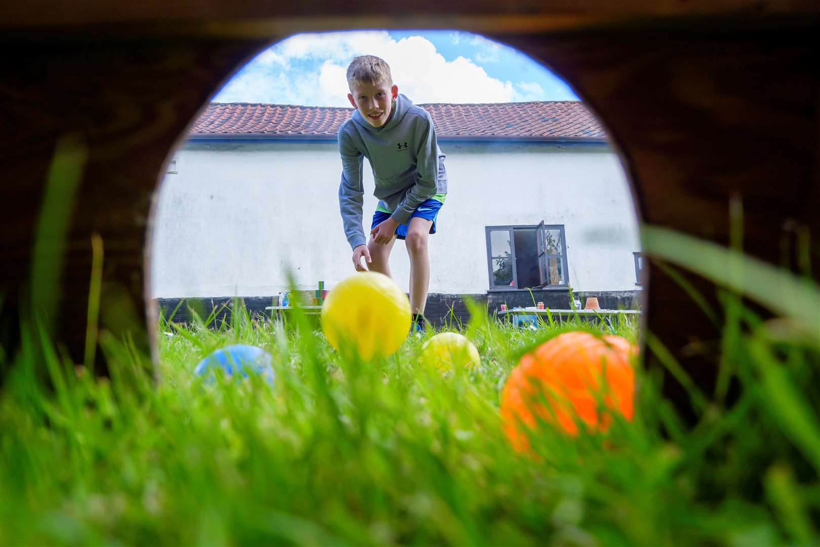 James Lord trying on of the games at the fete, flower and dog show. Picture: Mark Bullimore