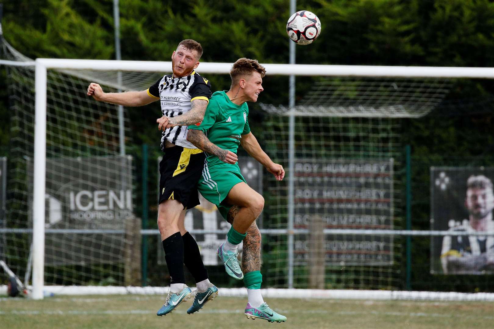 Harleston Town challenge for a header. Picture: Mark Bullimore