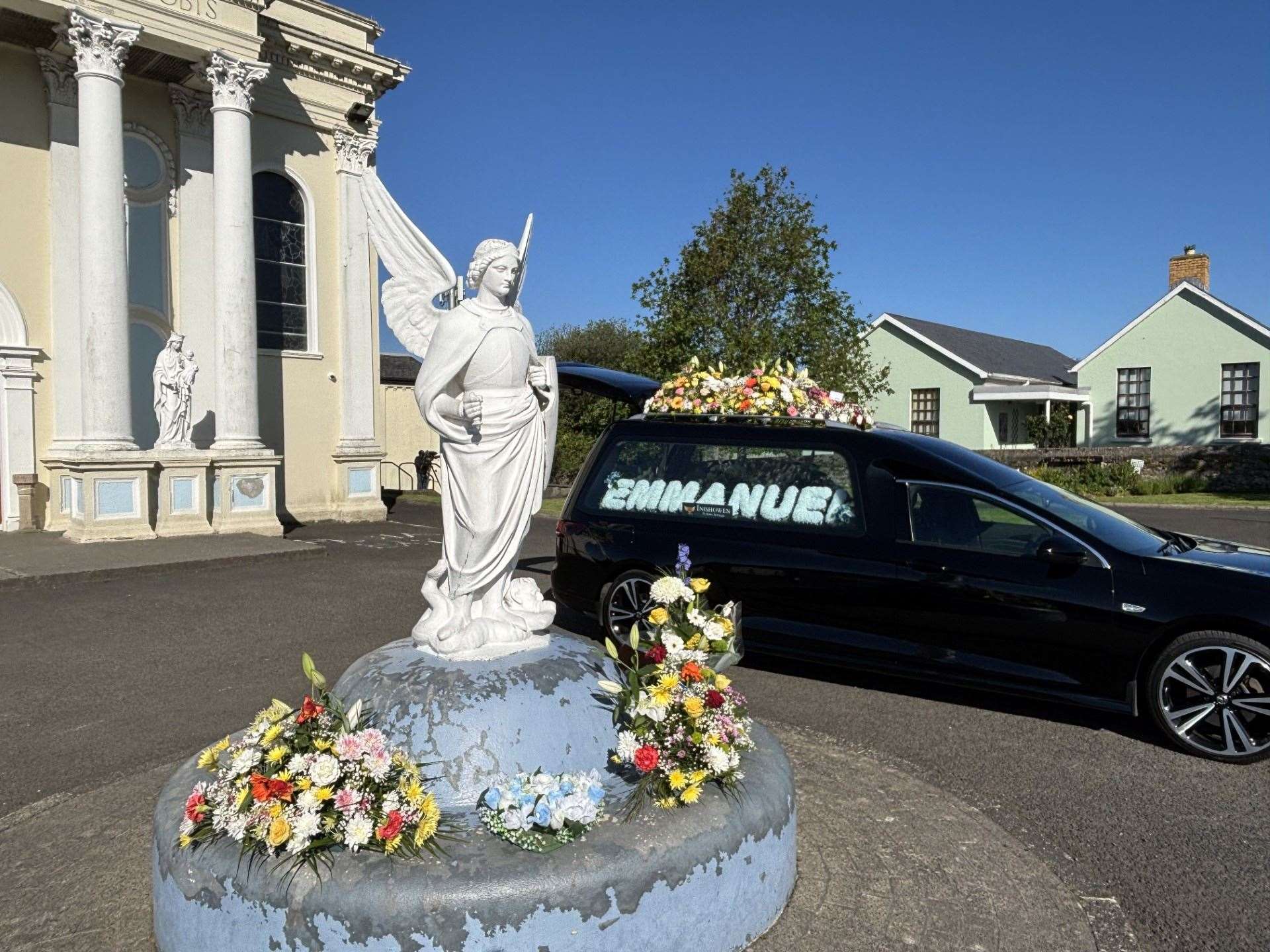 A hearse outside St Mary’s Oratory in Buncrana, Co Donegal, ahead of the funeral of Emmanuel Familola, 16, who drowned in the area last weekend. (Rebecca Black/PA)