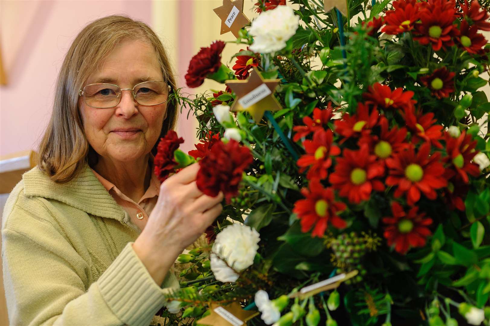 NINE SACRED BLESSINGS: Margaret Morrison with her flower display. Picture by Mark Bullimore Photography.
