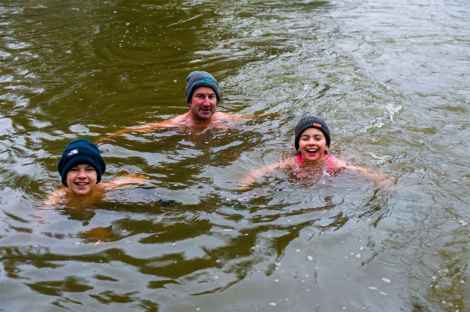 James, Jago and Florence Bucher swimming in the Little Ouse river at Knettishall Heath. Picture: Mark Bullimore Photography.