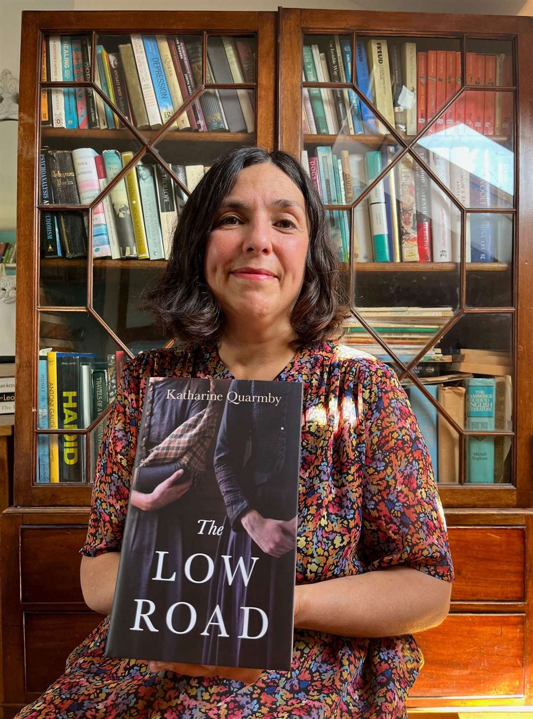 Katharine Quarmby with her book The Low Road. Credit Katharine Quarmby