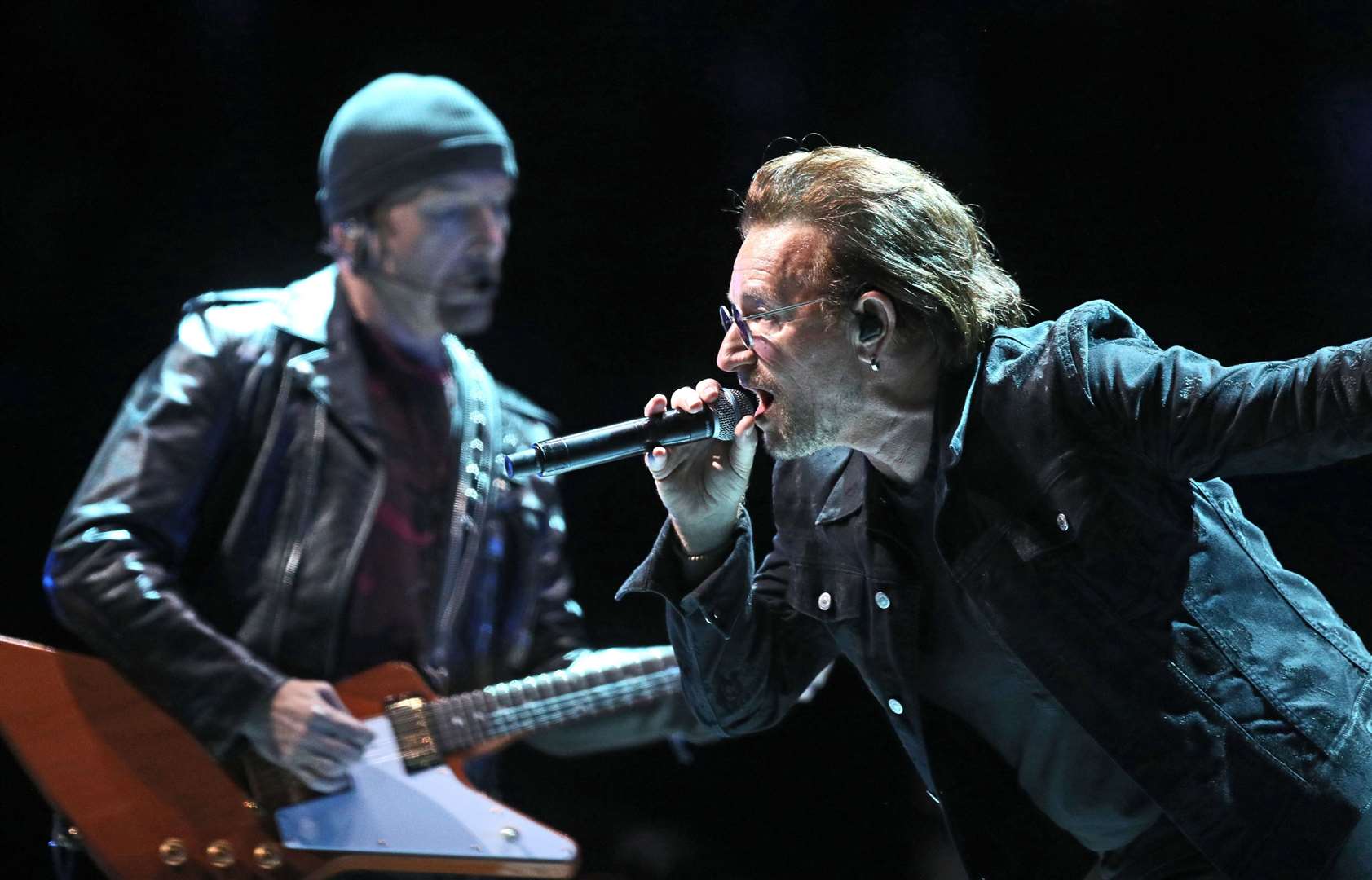 U2’s Bono and The Edge (left) performs on stage at the U2 eXPERIENCE + iNNOCENCE Tour. The O2 Arena, London.