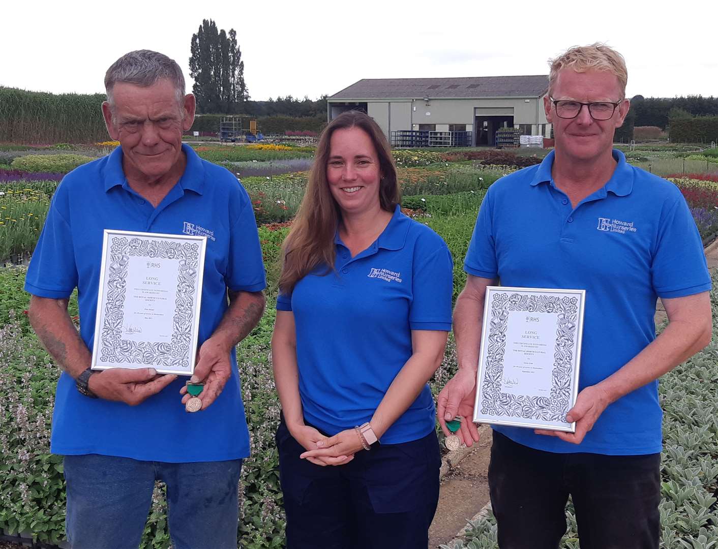 Peter Baxter and Gavin Erith with their Royal Horticultural Society medals and certificates alongside Howard Nurseries managing director Christine Howard. Picture: Kevin Hurst