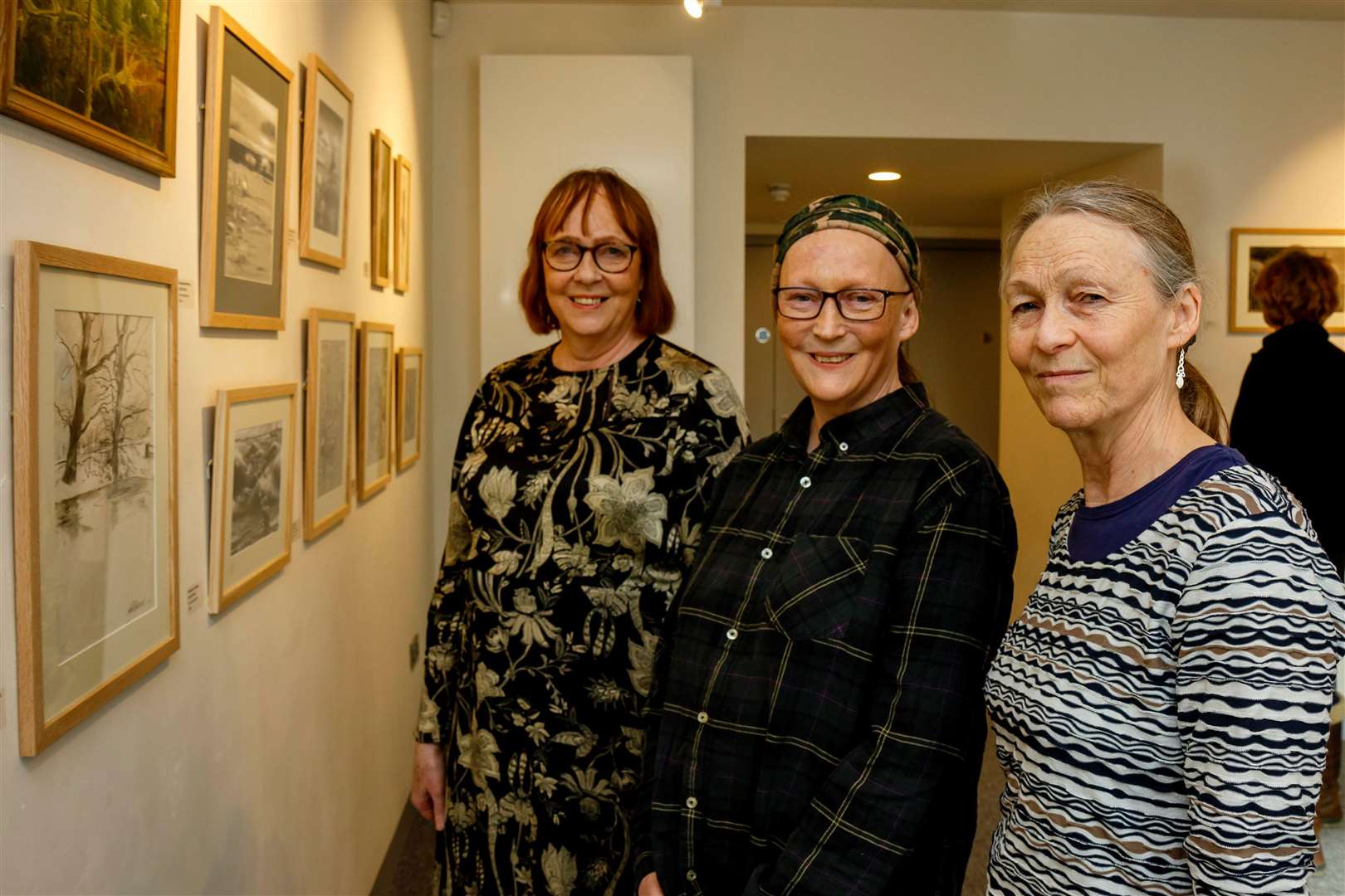 The artist’s daughters, Celine, Catherine and Clare, admire some of the work. Pictures: Mark Bullimore
