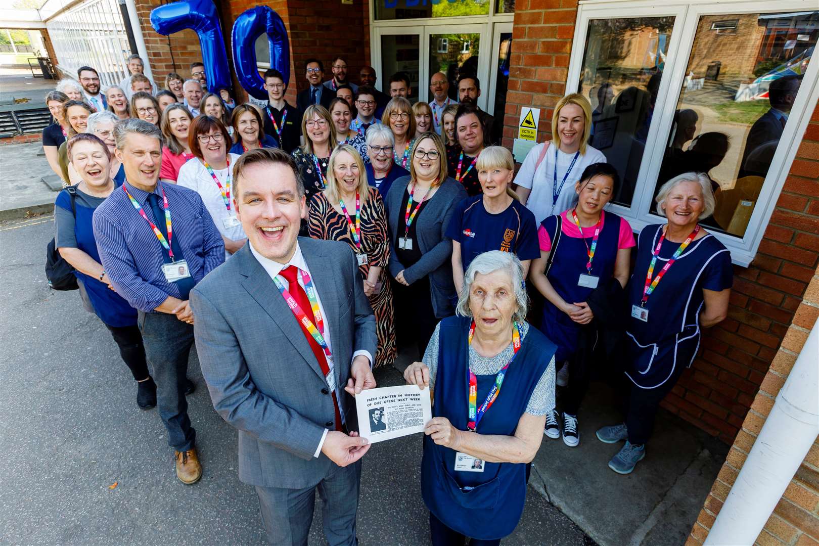 Headteacher Sam Stopps, Sheila Stringer and staff members and teachers of Diss High School marking the milestone. Picture: Mark Bullimore