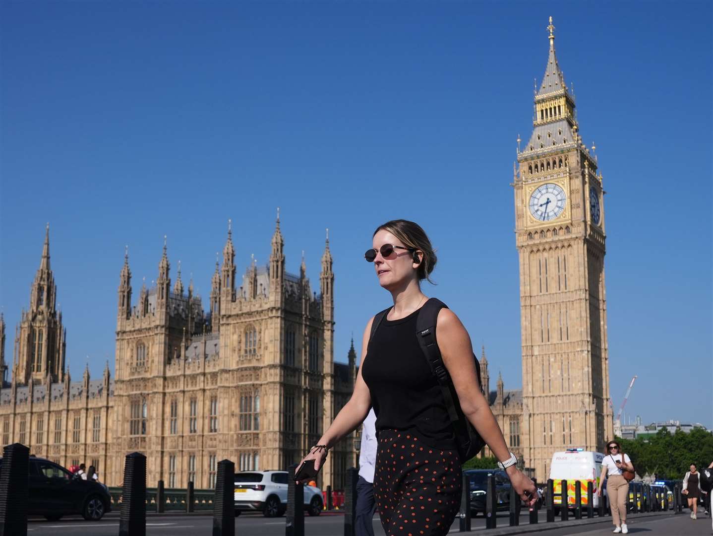 Many people up early in London donned sunglasses as they made their way to work (Jonathan Brady/PA)