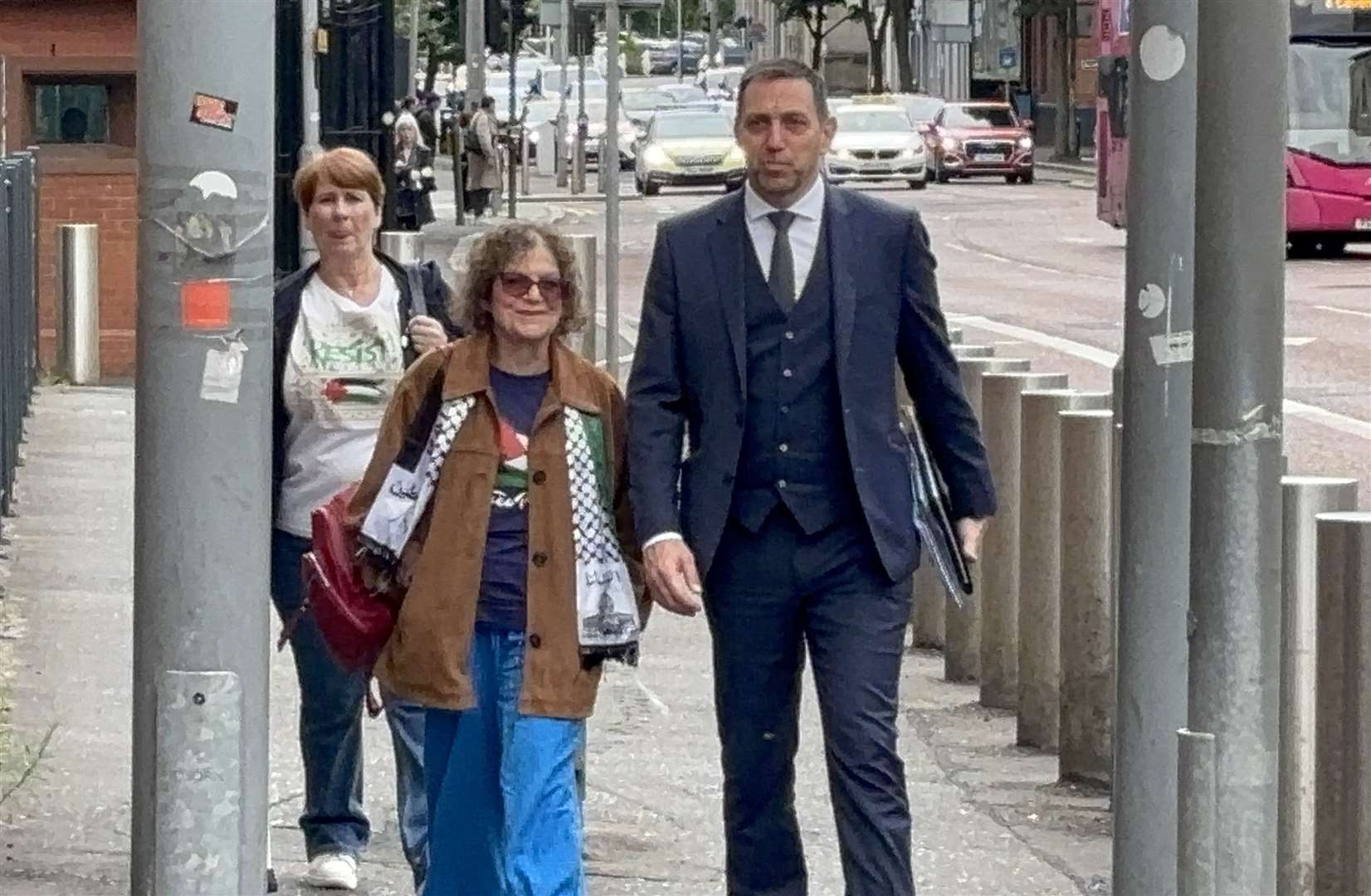 Martine McCullough and Sue Pentel and their solicitor Padraig O Muirigh arrive at Musgrave Street police station in Belfast for a police interview (Rebecca Black/PA)
