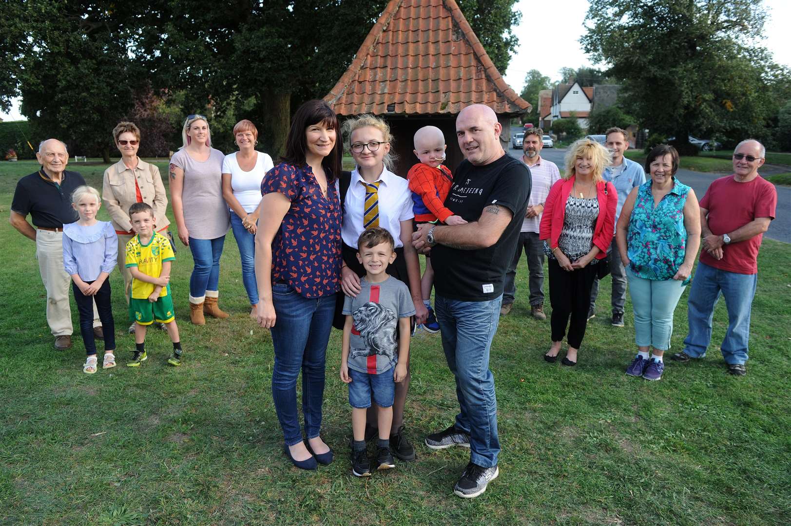 Joe Rourke, four, mum Louise, dad Sean, sister Jenny, 13 and brother Patrick, six, with Redgrave villagers delighted to see the youngsters back home. Picture by Mecha Morton.