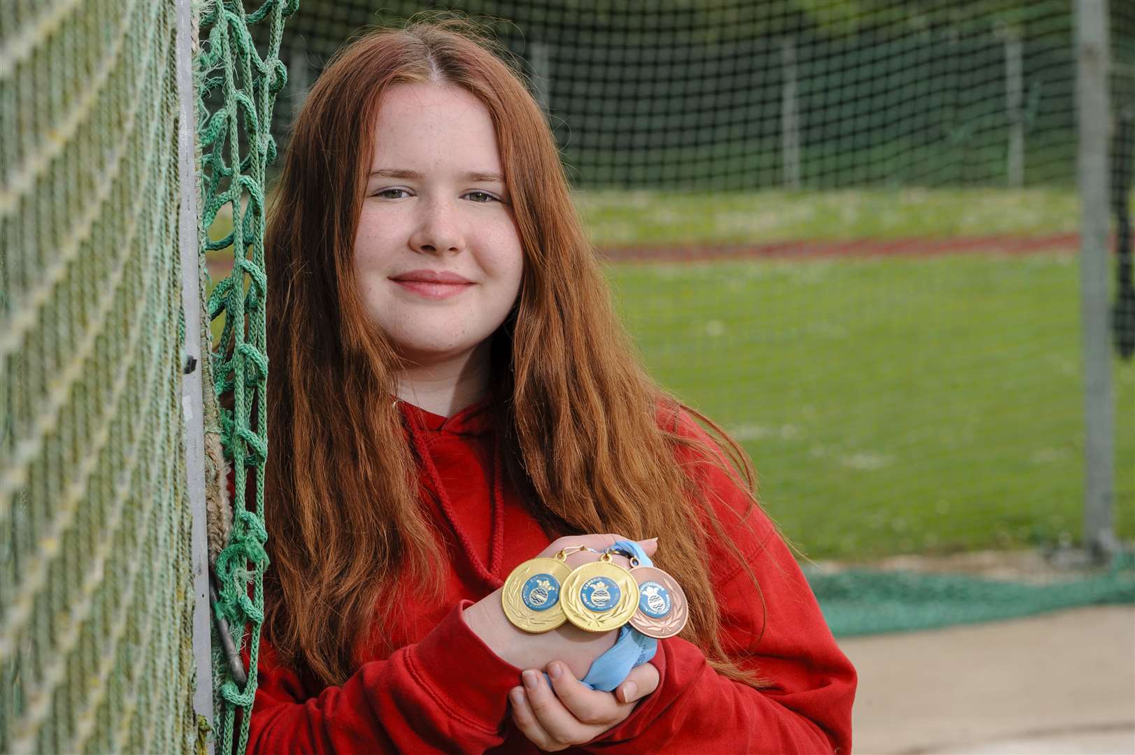 Luella Brooke with her three medals won at county athletics championships...Picture: Mark Bullimore Photography. (11856899)