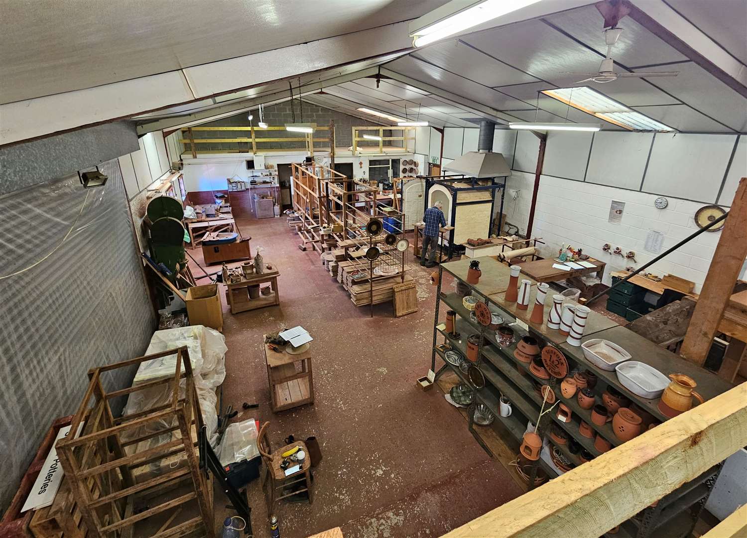 The studio currently has two wheels, a 35 cubic foot gas kiln, a pug mill, an extruder as well as hand building stations.