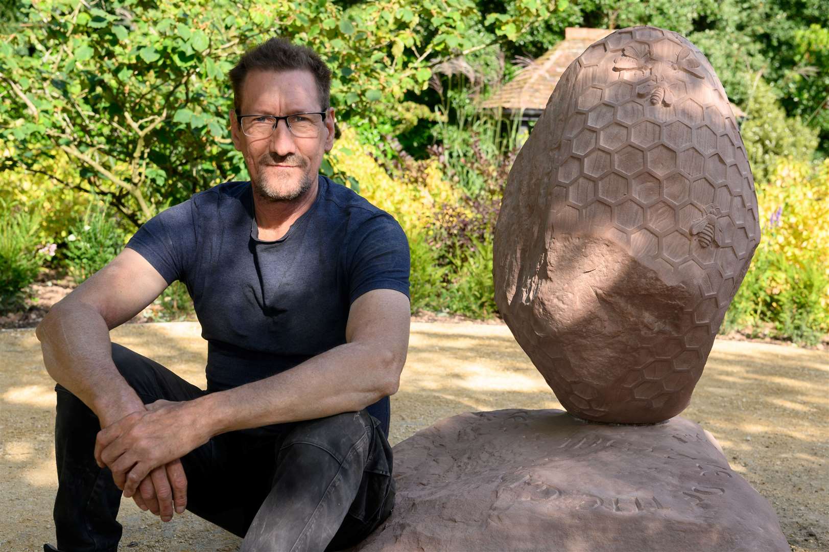 Dan Meek with his sculpture, ‘A Fine Balance’. Pictures: Contributed