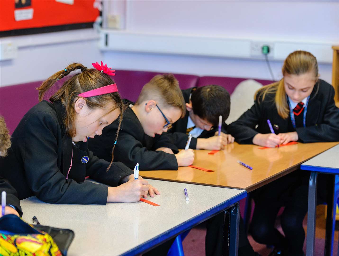 THOUGHTFUL: Students take their time writing notes to each other.