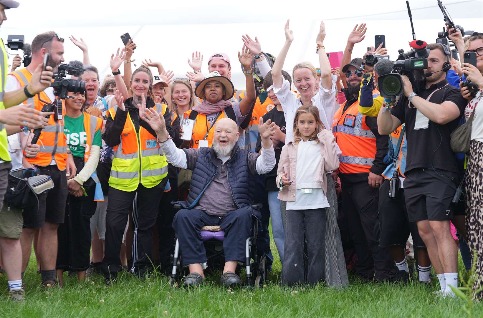 Organiser Emily Eavis and her father, co-founder Sir Michael Eavis, open the gates on the first day of the Glastonbury Festival at Worthy Farm (Yui Mok/PA)