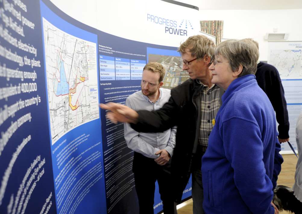 Mellis, Suffolk. Consultation about the proposed power station for Eye Industrial Estate at Mellis Village Hall pictured is CHris Leach talking to Sue and Kevin Brudenell ENGANL00120131014123313