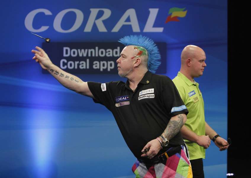 SOUNDLY BEATEN: Peter Wright was no match for Michael van Gerwen in the Betway Premier League. PICTURE: Lawrence Lustig