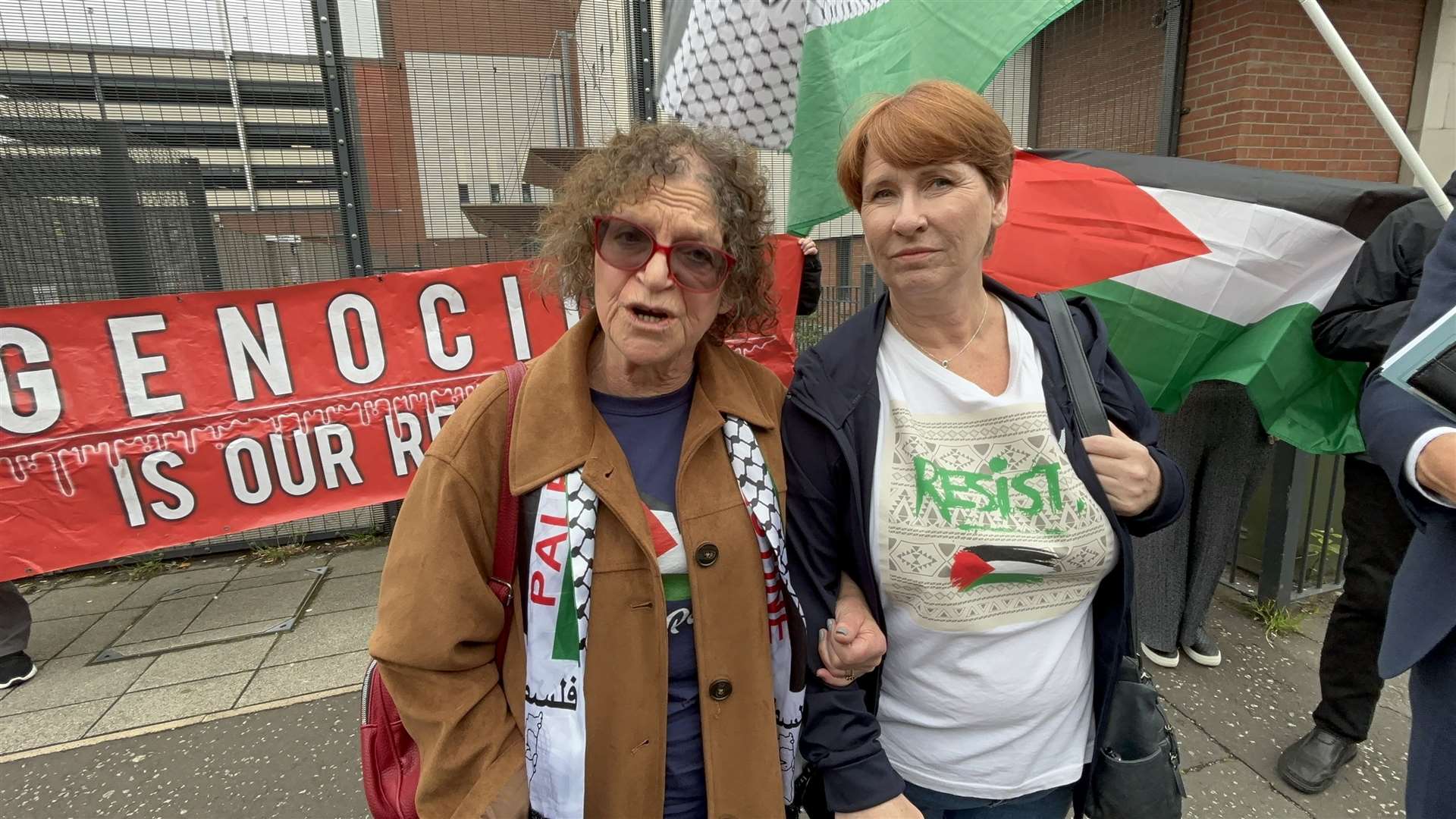 (l-r) Sue Pentel and Martine McCullough, and their solicitor Padraig O Muirigh arrive at Musgrave Street police station in Belfast for a pre-arranged police interview after the pair were arrested last month pro-Palestine protest outside a Barclays bank (Rebecca Black/PA)
