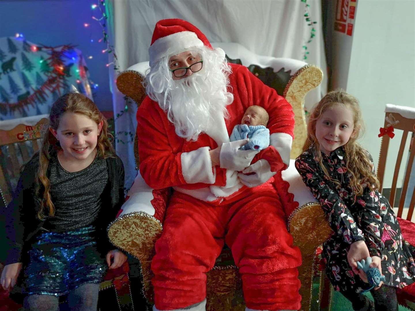 Cadence, Sienna and Jesse with Santa Claus.