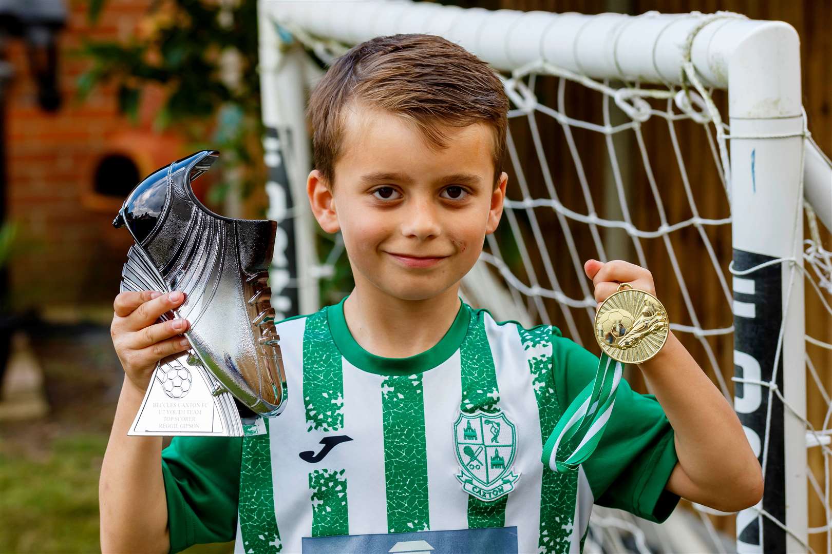 Reggie Gipson with his golden boot award. Picture: Mark Bullimore
