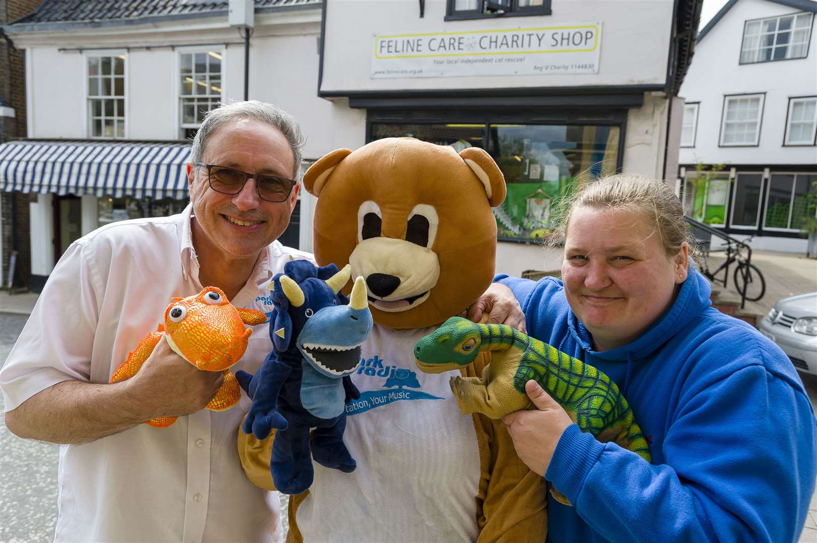 Do-you-think-he-saurus: Chris Moyse and Parky Bear, from Park Radio, with Claire Baggott, from Feline Care Charity Shop. Picture: Mark Bullimore