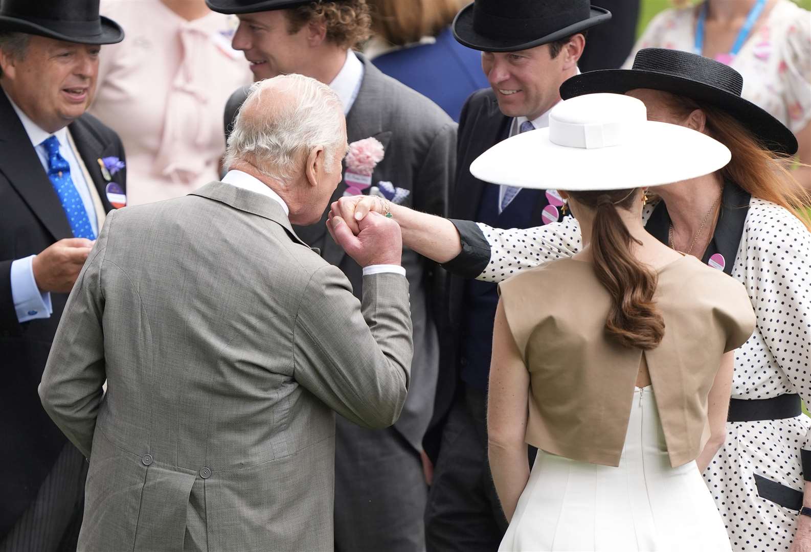 King Charles kisses the hand of Sarah, Duchess of York (Andrew Matthews/PA)
