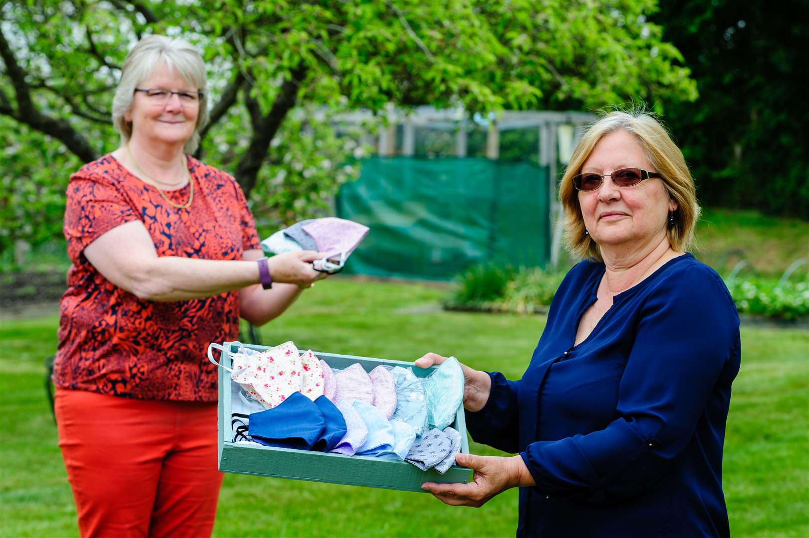Jackie Mitchell, front, and Alison Holman, with some of the masks which are raising money for Kenninghall Kicking Cancer. Picture: Mark Bullimore
