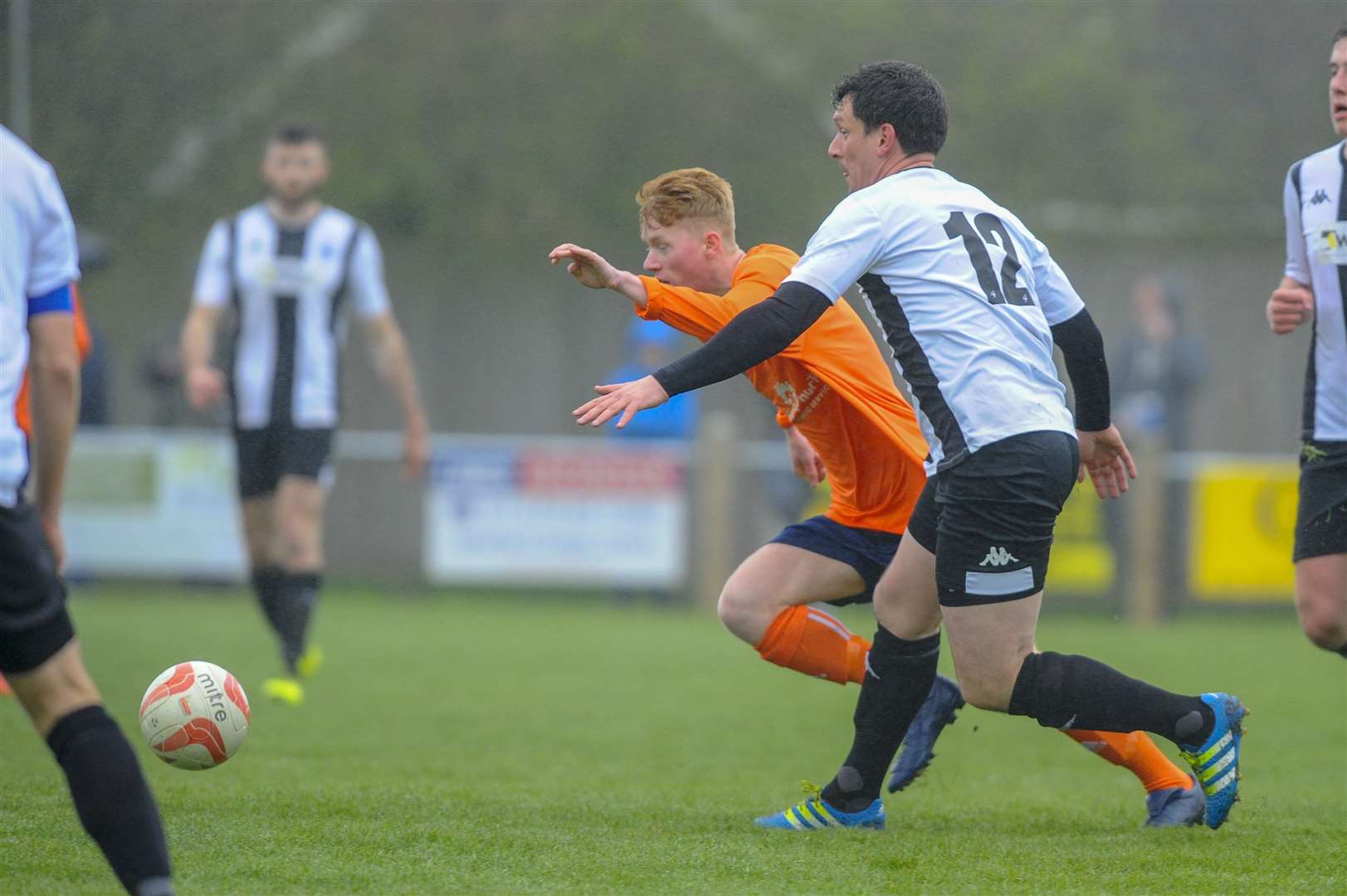 Football action from Harleston Town vs Diss Town FC - Connor Grren (H) and Kieron Haegan (D)..Picture: Mark Bullimore Photography. (8452739)