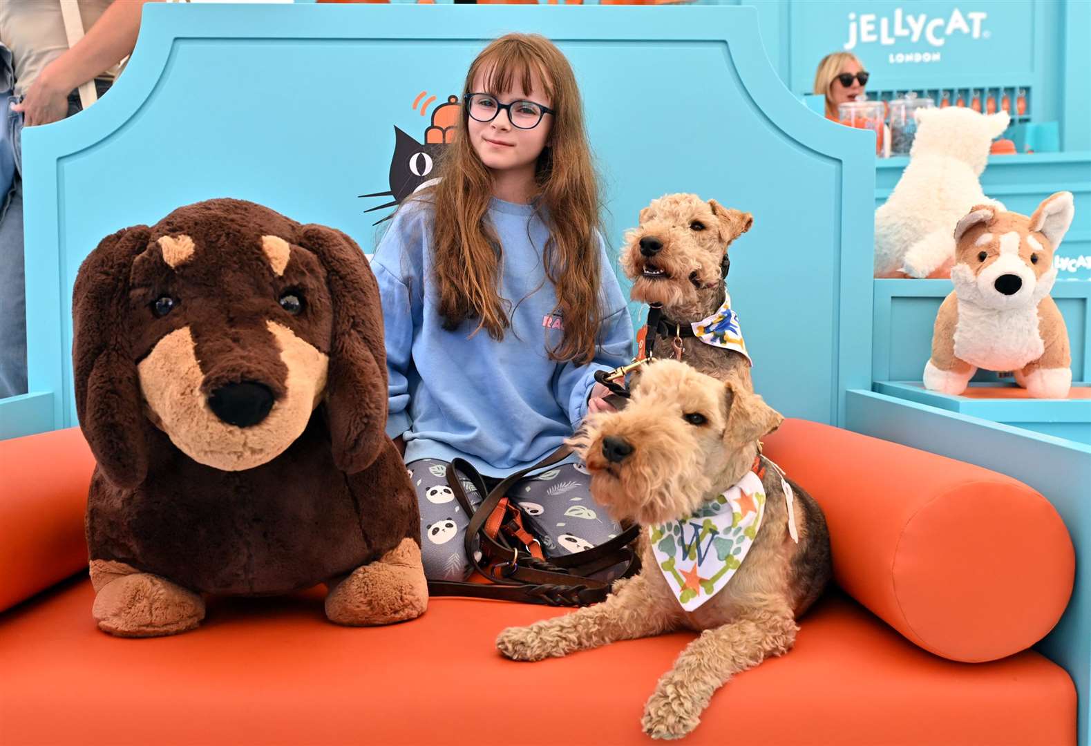 Letty Swindells, aged 10, with dogs Woody and Raffy at Goodwoof (Jas Lehal Media Assignments/PA)