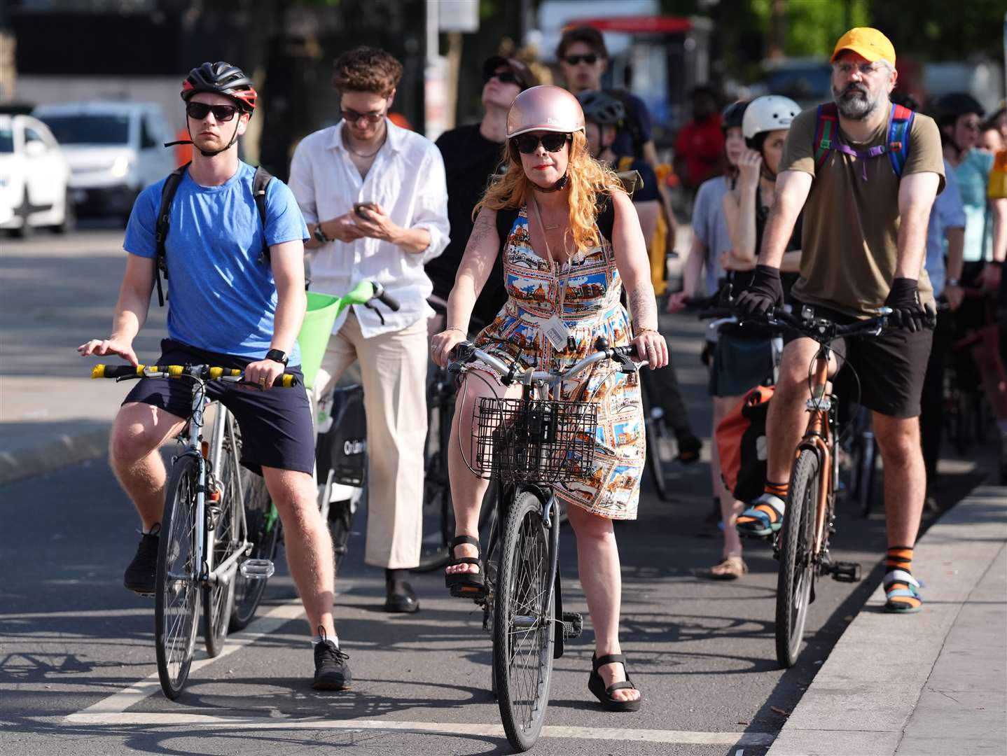 Cyclists on their morning commute tried to stay cool by wearing shorts, baseball caps, sandals and loose fitting clothing (PA)