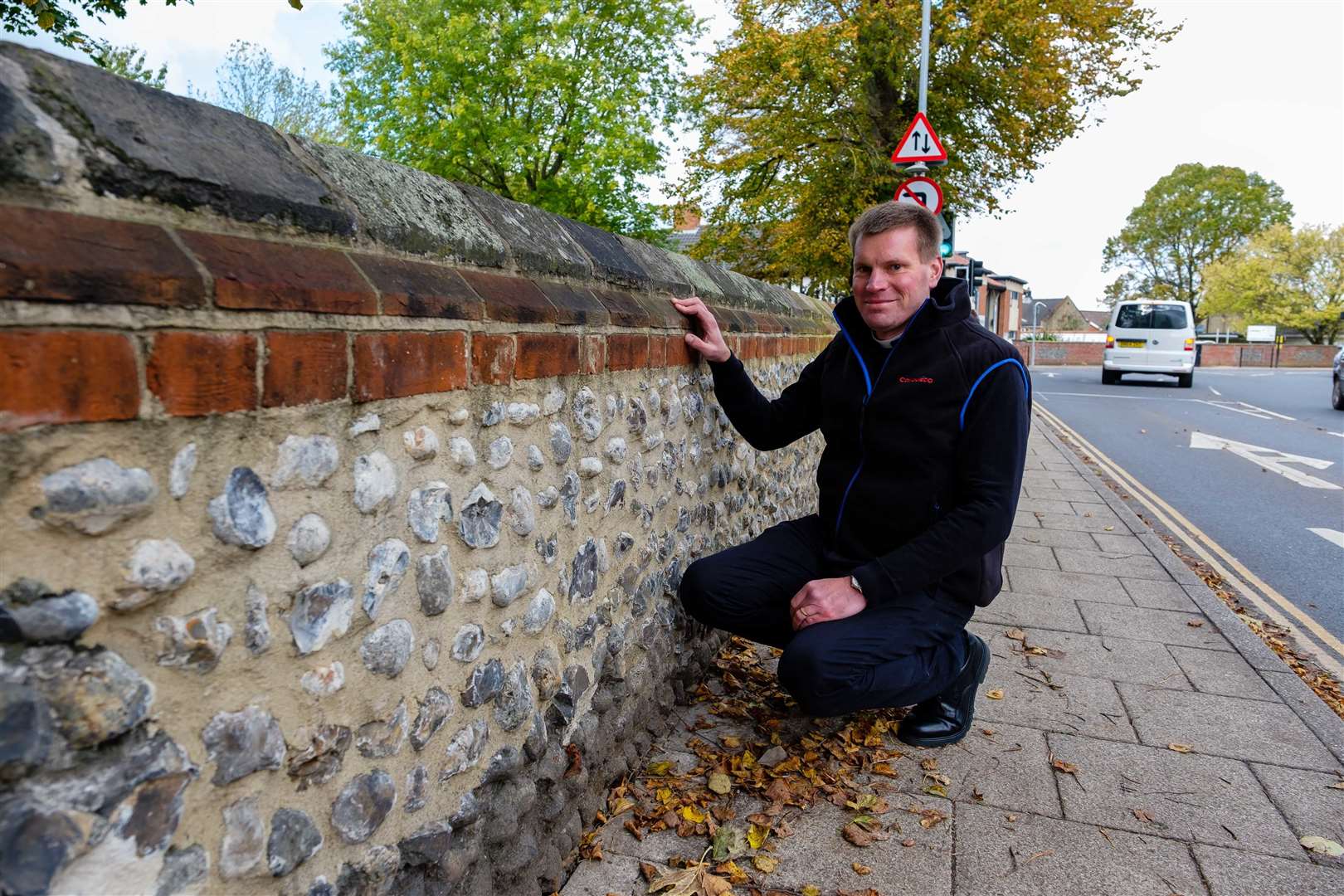 Attleborough, Norfolk, 07/10/2020..Rector Matthew Jackson pictured beside the church wall has been struck by vehicles twice in the past year and has recently been rebuilt at the expense of the Town Council...Picture: Mark Bullimore Photography. (42611045)