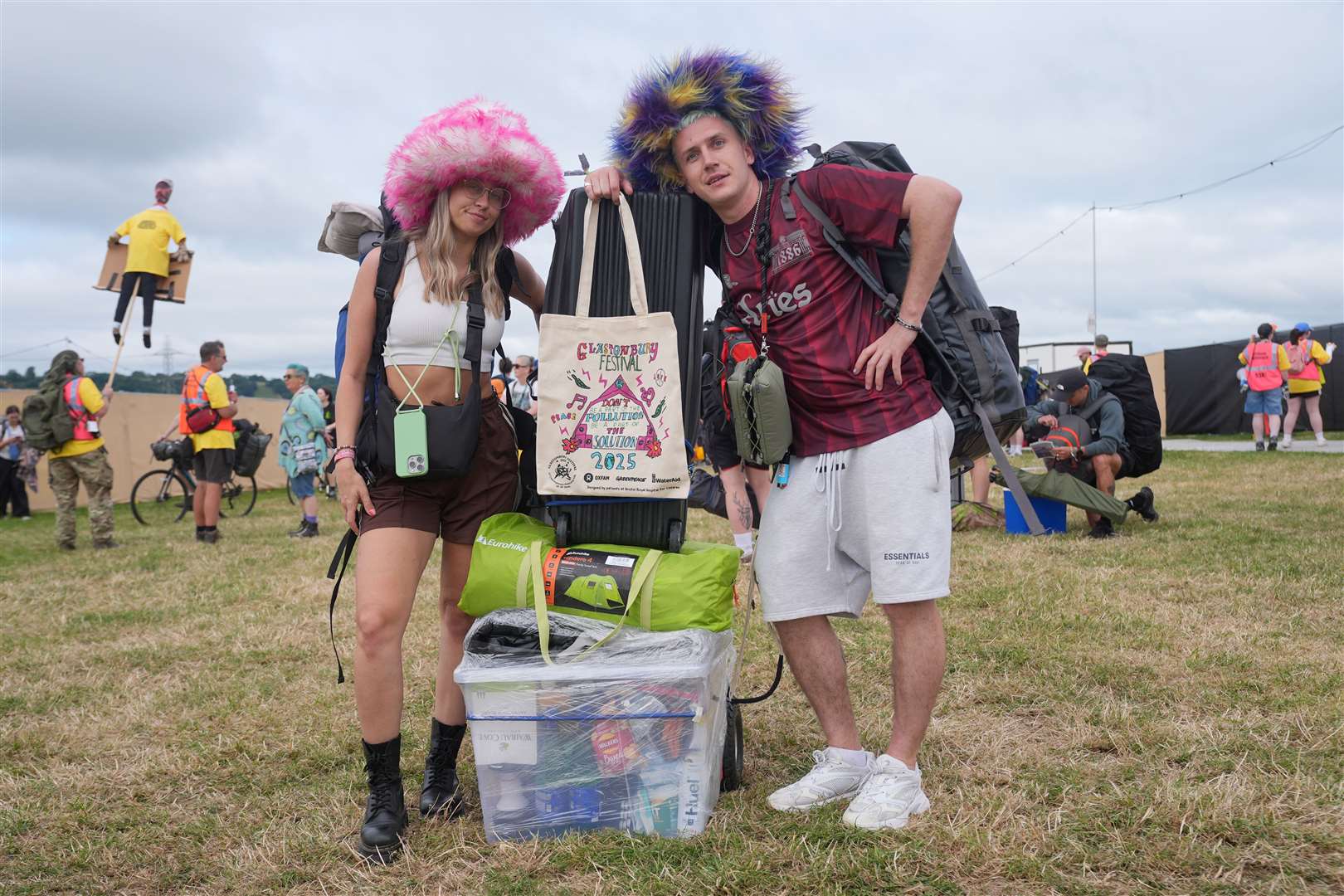 Revellers make their way into the site on the first day of the Glastonbury Festival (Yui Mok/PA)