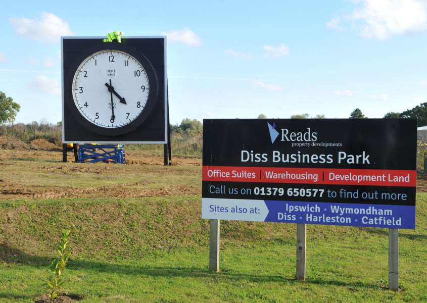 Giant clock at the entrance to Diss Business Park ANL-150930-114352009