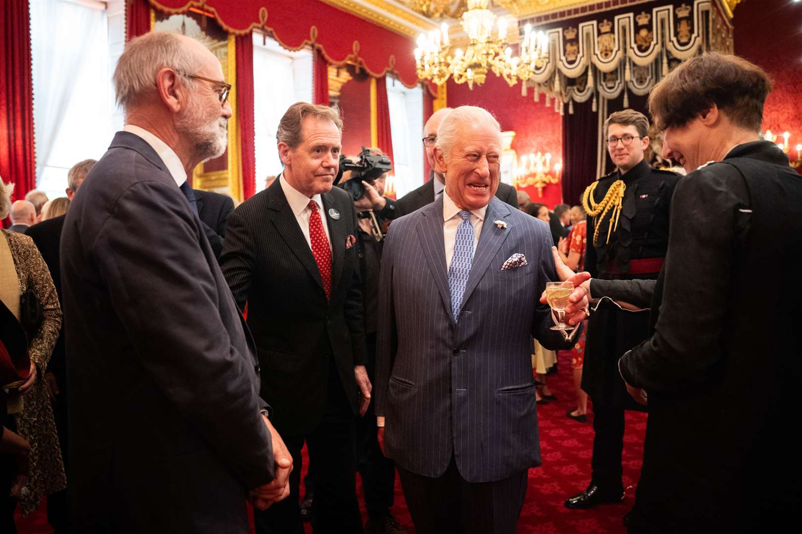 King Charles speaks with guests during a reception at St James’s Palace, London, to celebrate 25 years of the Royal Drawing School (James Manning/PA)