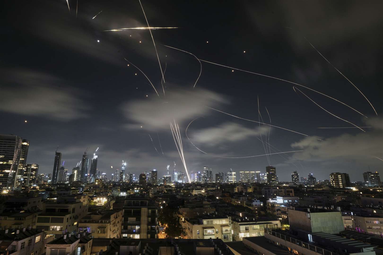 The Israeli Iron Dome air defence system fires to intercept missiles during an Iranian attack over Tel Aviv early on Wednesday (Leo Correa/AP)