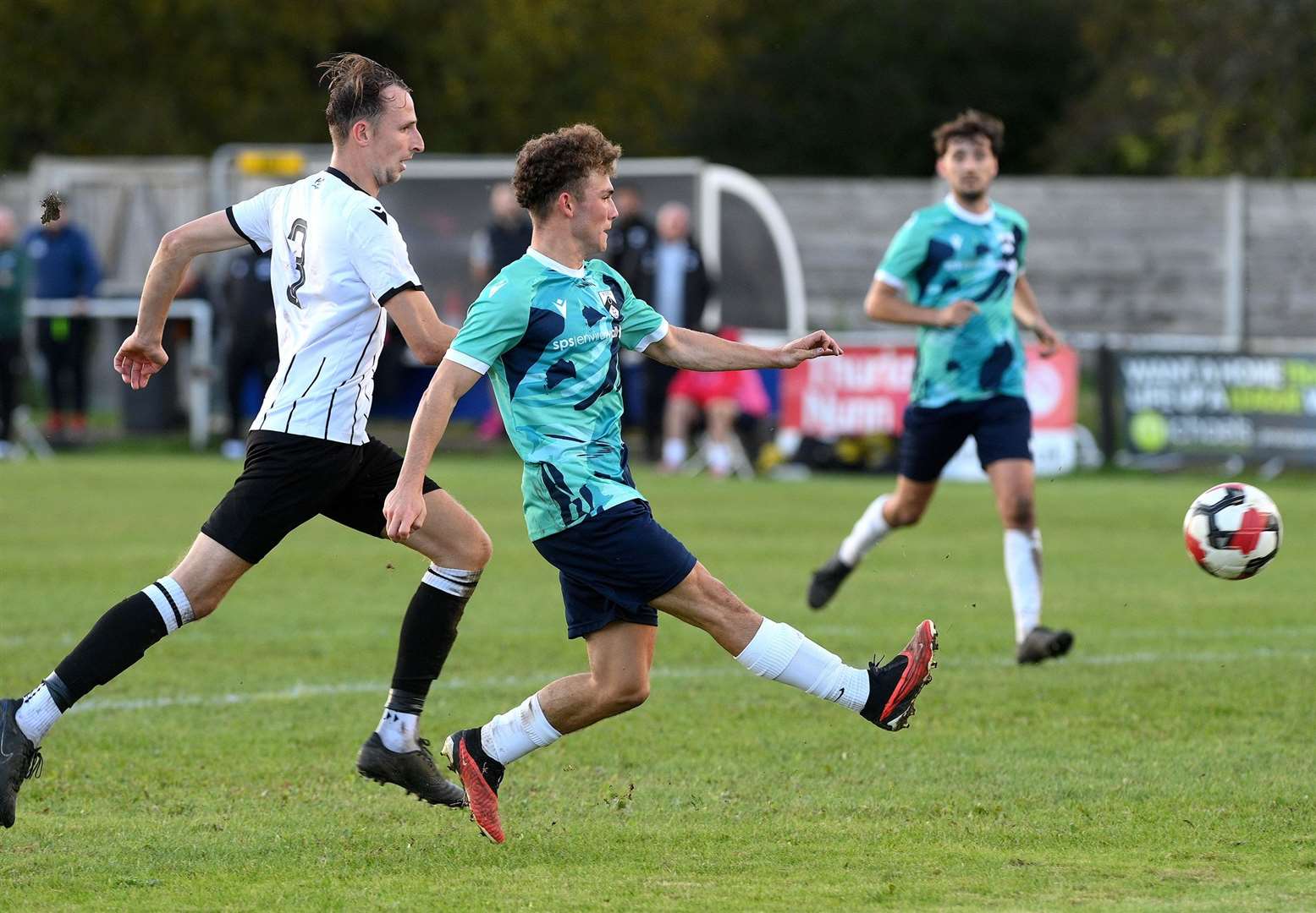 Asa McGeachy converts a third goal for Harleston Town in the second half of their FA Vase victory at Halstead Town Picture: Mecha Morton