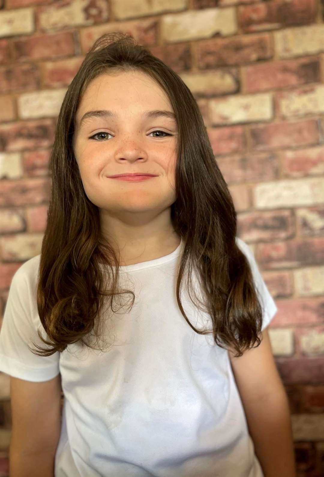 Bryn show how long his hair is before the big cut. Pictures submitted