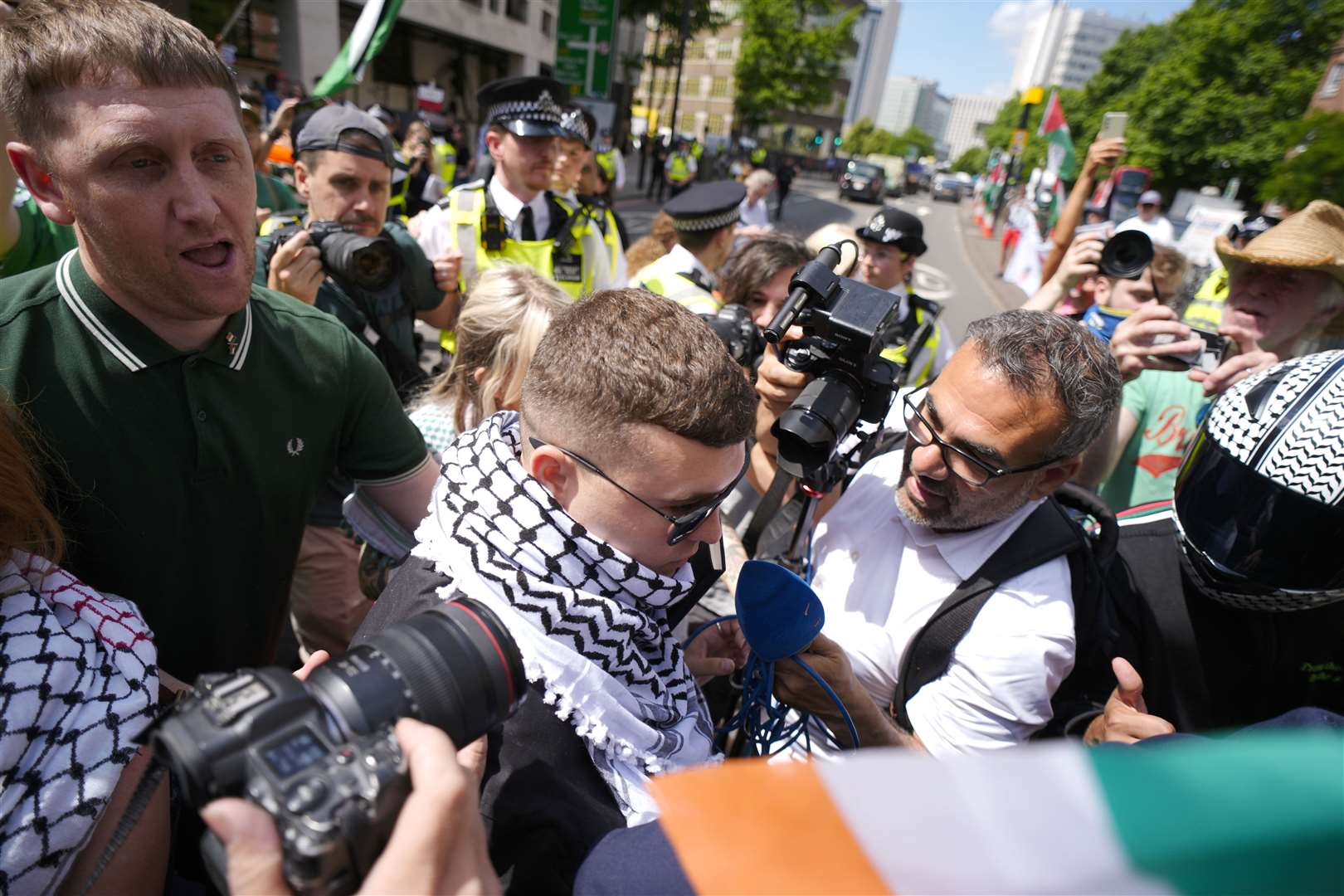 Kneecap’s Liam Og O hAnnaidh leaves Westminster Magistrates’ Court through a crowd of supporters (Jordan Pettitt/PA)