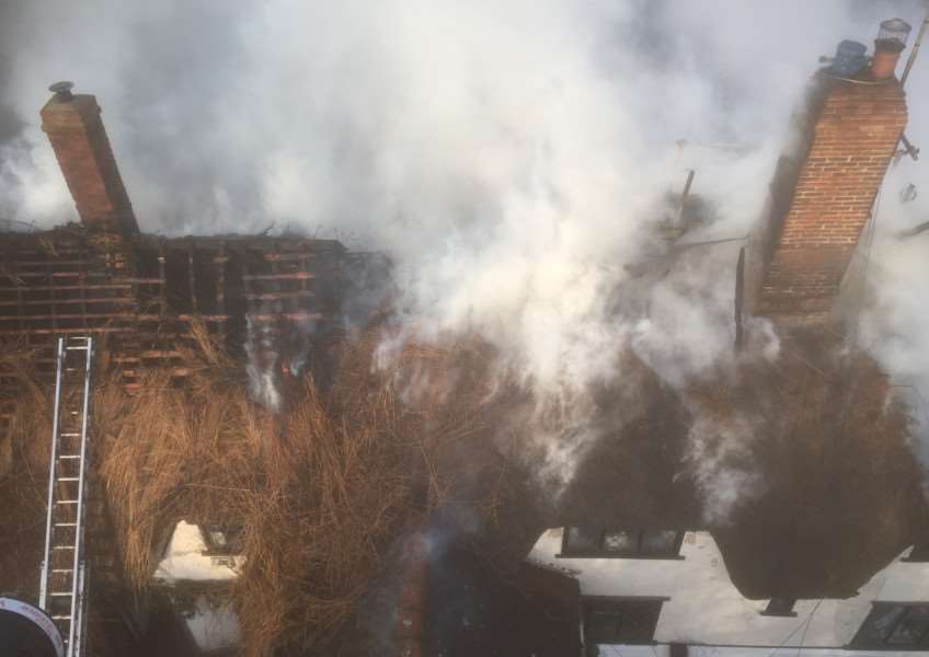Fire crews pulled down the thatch to get to the fire ANL-160122-110656001