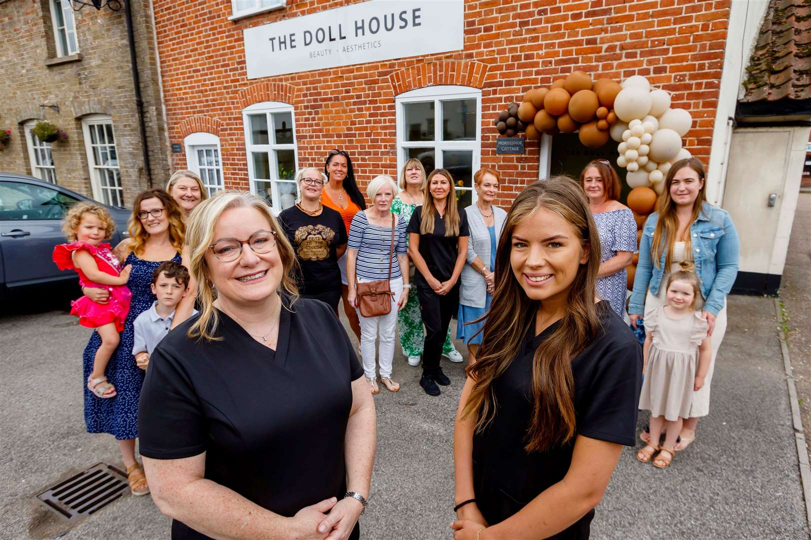 The opening of The Doll House in Long Stratton – owners Emma Browne and Zara White with friends, family and members of staff at the event. Picture: Mark Bullimore