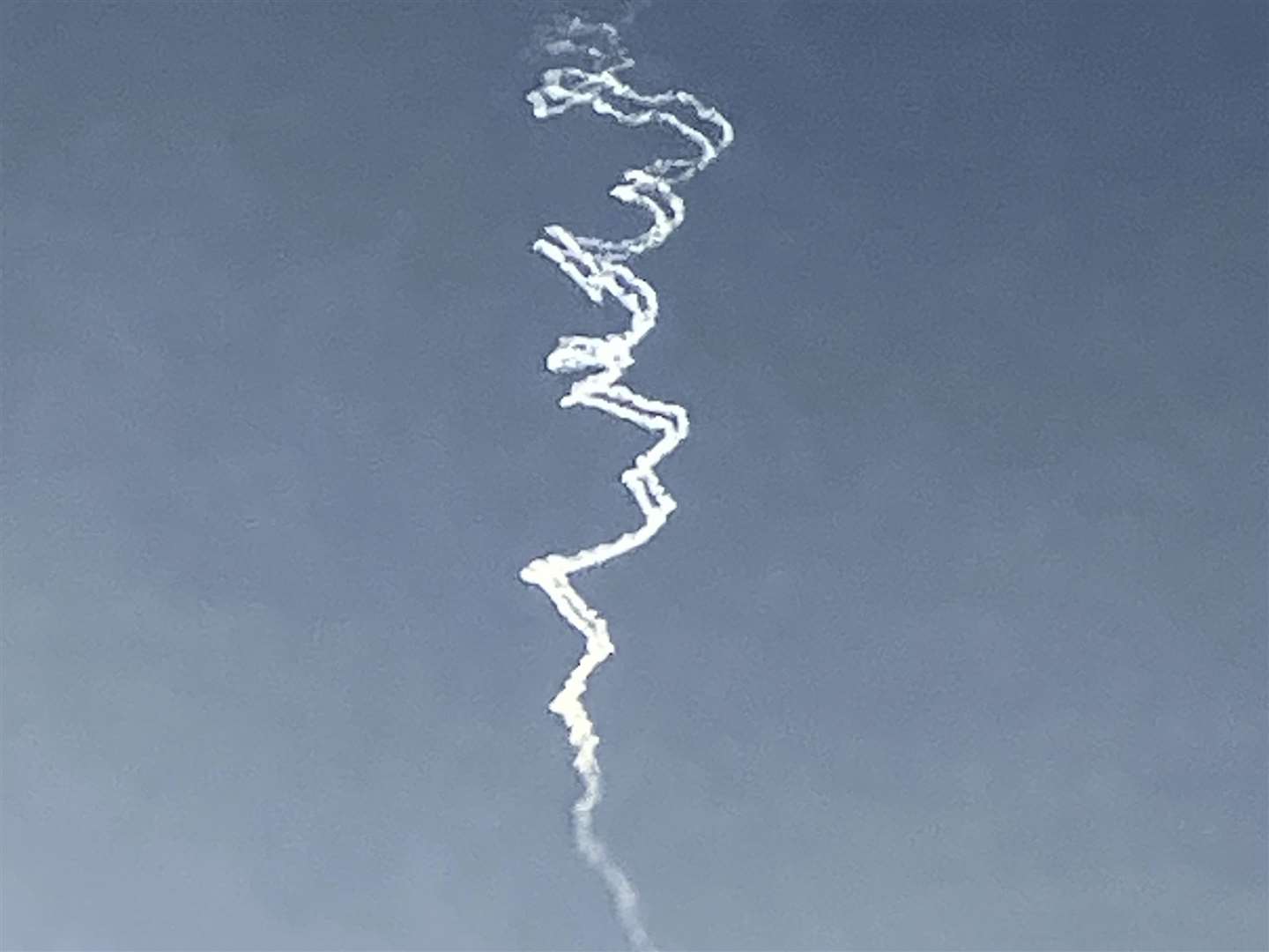 Smoke trails from Israeli air defence system are seen in the sky as it intercepts missiles launched during an Iranian attack on Tuesday (Ariel Schalit/AP)